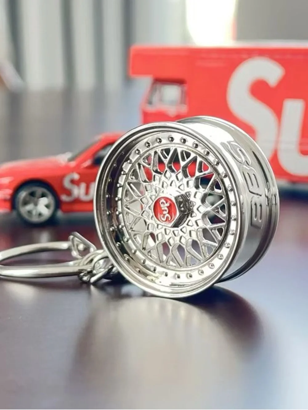 Supreme Silver Wheel Keychain with Red Logo Center